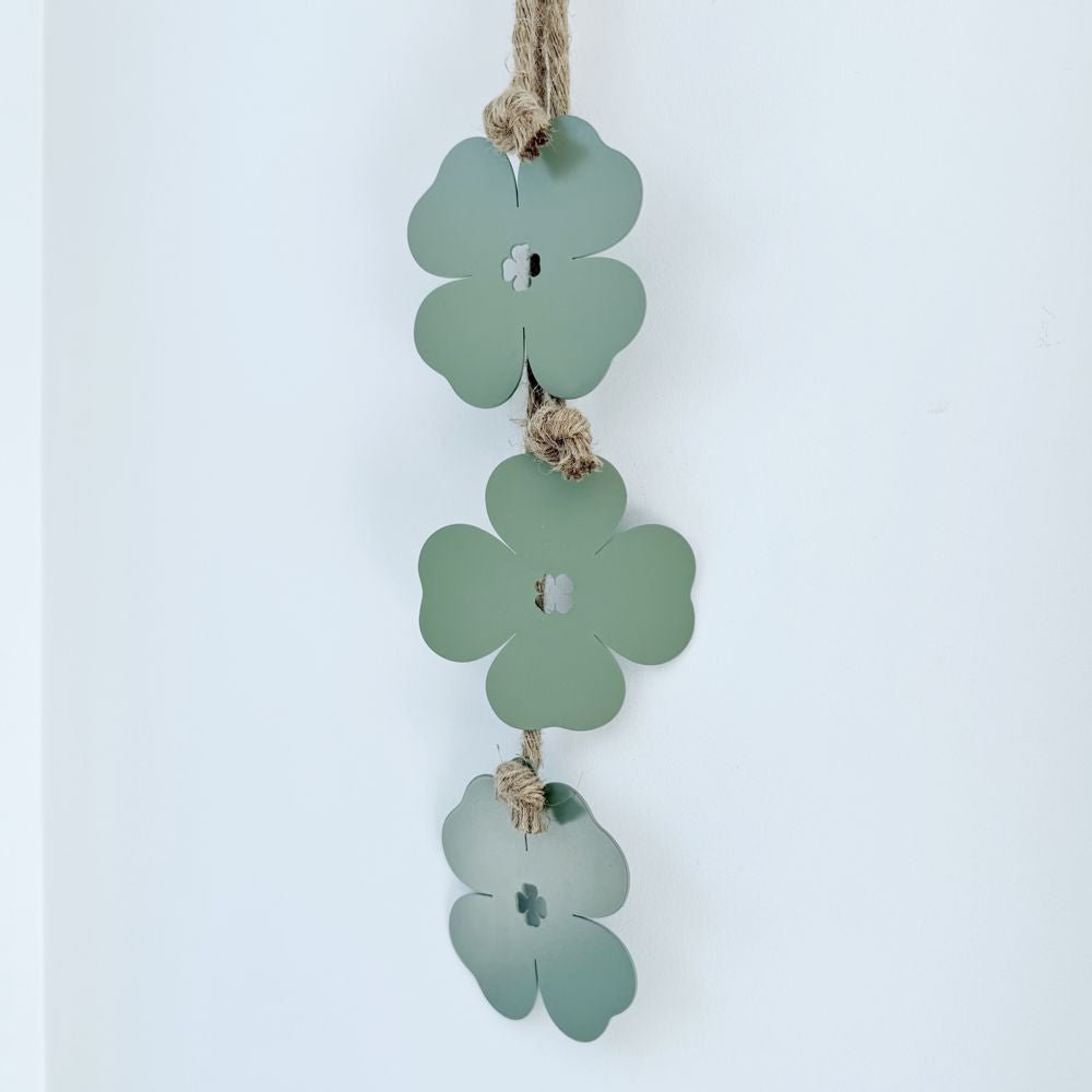 Sage green four leaf clover wall decor on NZ living room wall. 