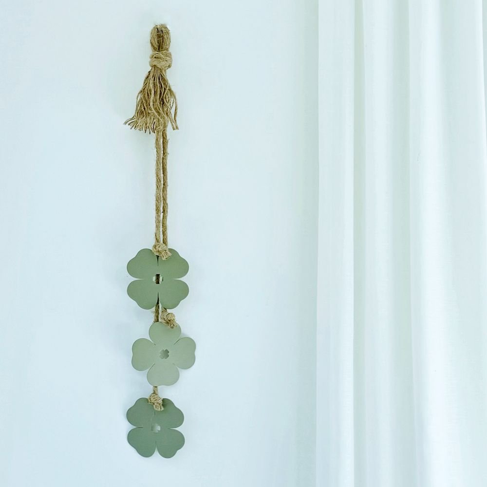 Sage green four leaf clover wall decor on NZ living room wall. 