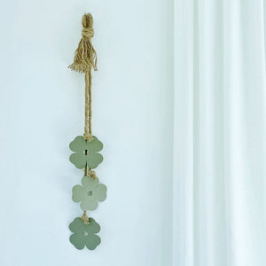 Sage green four leaf clover wall decor on NZ living room wall. 