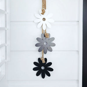 Steel Daisy & Rope Wall Hanging in close-up view, highlighting its hand-tied rope, 13cm steel daisies, and UV-resistant coating for durable indoor and outdoor décor.