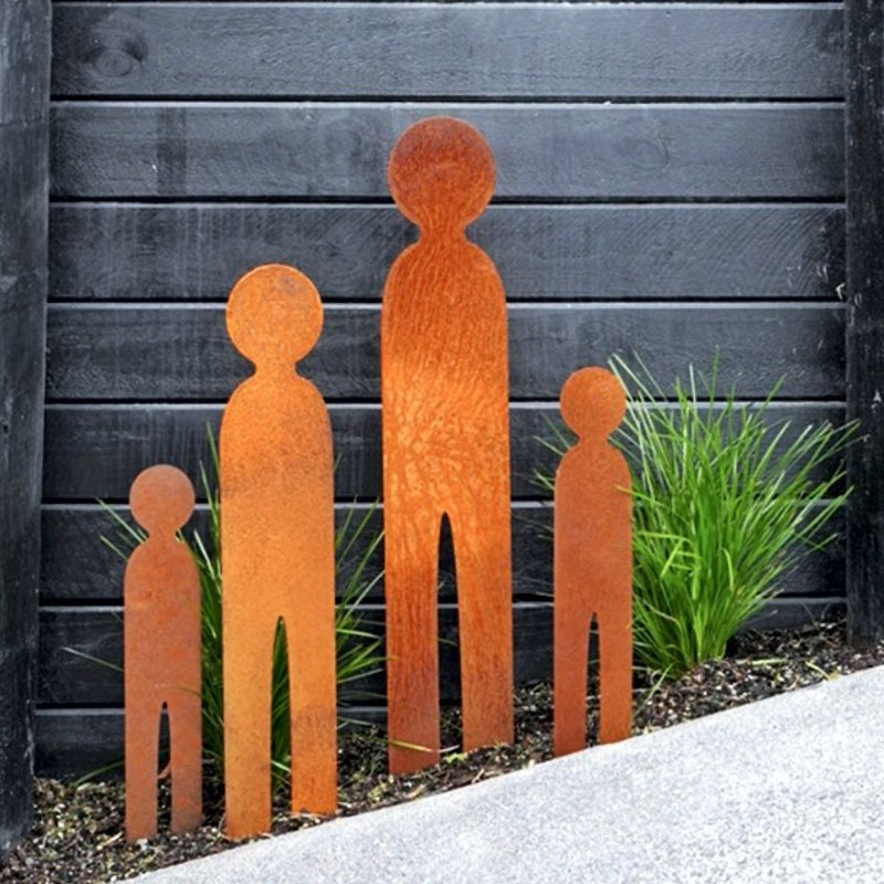 Corten steel garden stakes representing family in a modern garden in Auckland, New Zealand