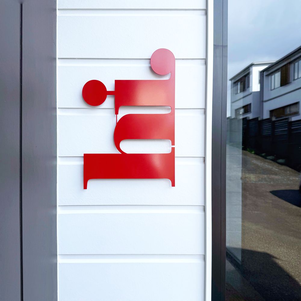 Red wall art on outdoor wall New Zealand