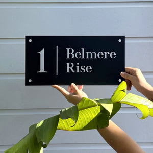 Traditional House Numbers in black steel on home in Auckland, New Zealand. 