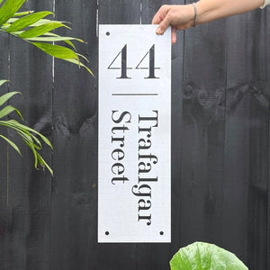 60cm x 20cm vertical 316 brushed stainless steel address sign on black fence at traditional New Zealand villa