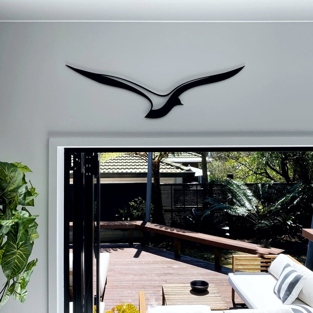 NZ made bird wall art in black steel shown in modern NZ kitchen. 