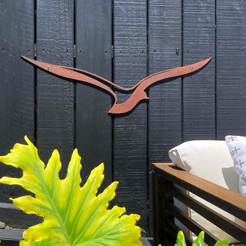 NZ-made corten steel outdoor wall art - bird in flight by LisaSarah on NZ fence. 