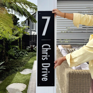custom black steel address sign beside front entrance NZ home