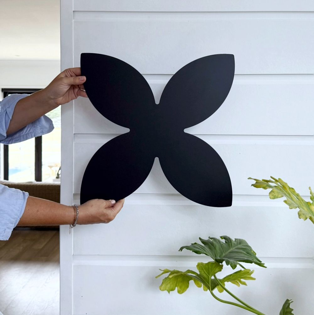 NZ-made black steel frangipani wall art – handcrafted botanical metal decor by LisaSarah