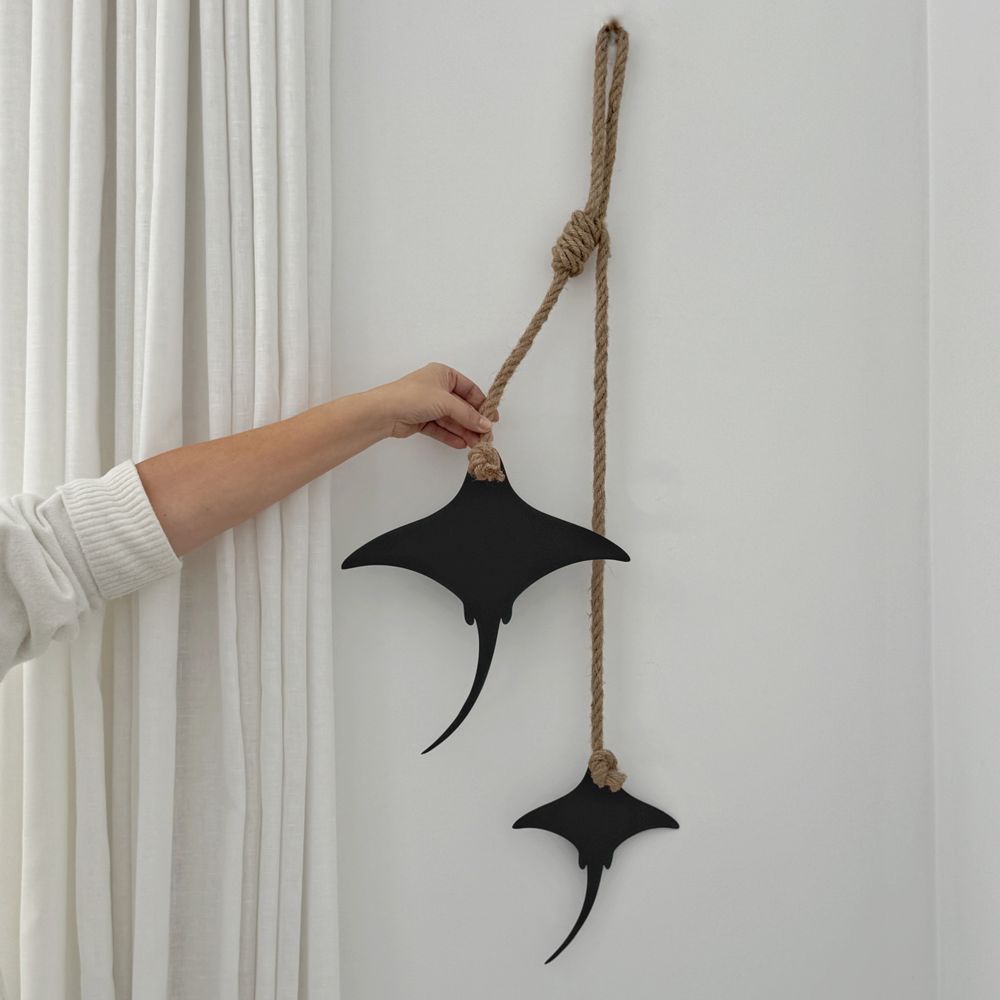 Two matt black steel stingrays on rope, 105cm wall hanging, New Zealand made