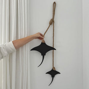 Close up of the cut edge and matt black finish on a steel stingray wall hanging