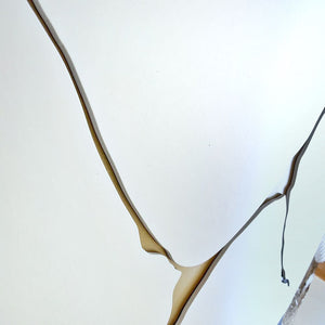 Close up angled view of kintsugi wall art