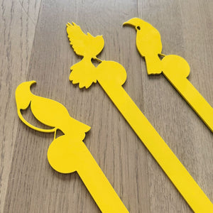 Close up of bright yellow NZ bird garden decor by LisaSarah