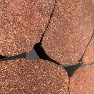 Corten steel round wall art close up detail. 