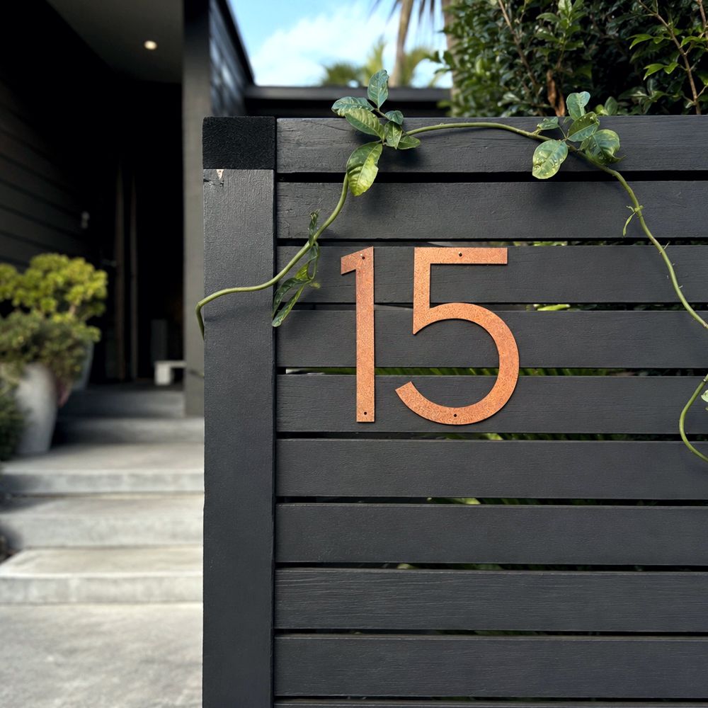 Corten steel custom house number 15 on a modern fence at an auckland home