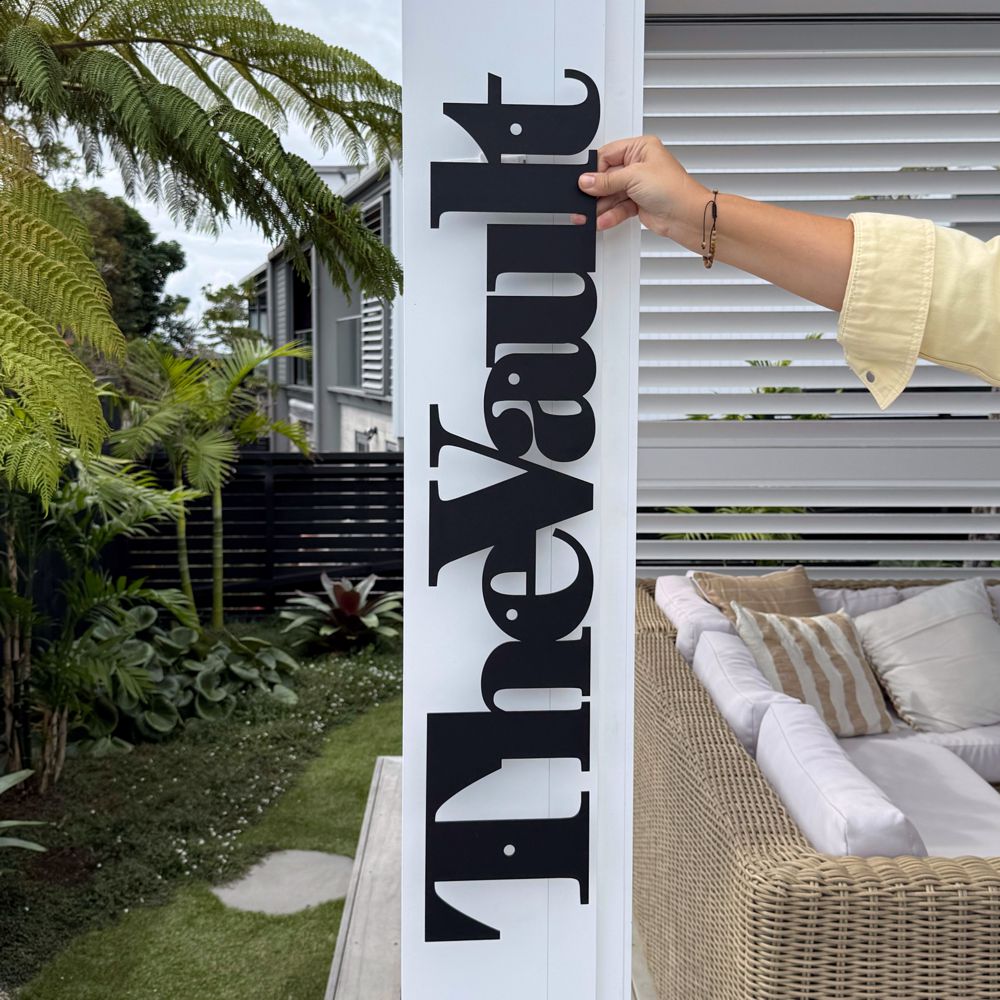 personalised black steel word sign installed NZ exterior