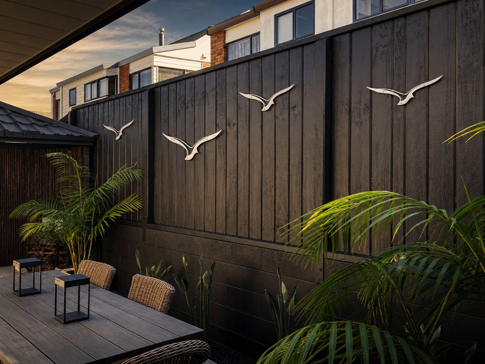 Custom outdoor bird wall art by lisasarah in a modern mount maunganui patio space, bespoke nz made steel wall art for outdoor and architectural homes