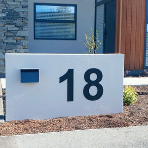 50cm matte black steel house numbers installed on a modern new build home in Christchurch, New Zealand by LisaSarah Steel Designs