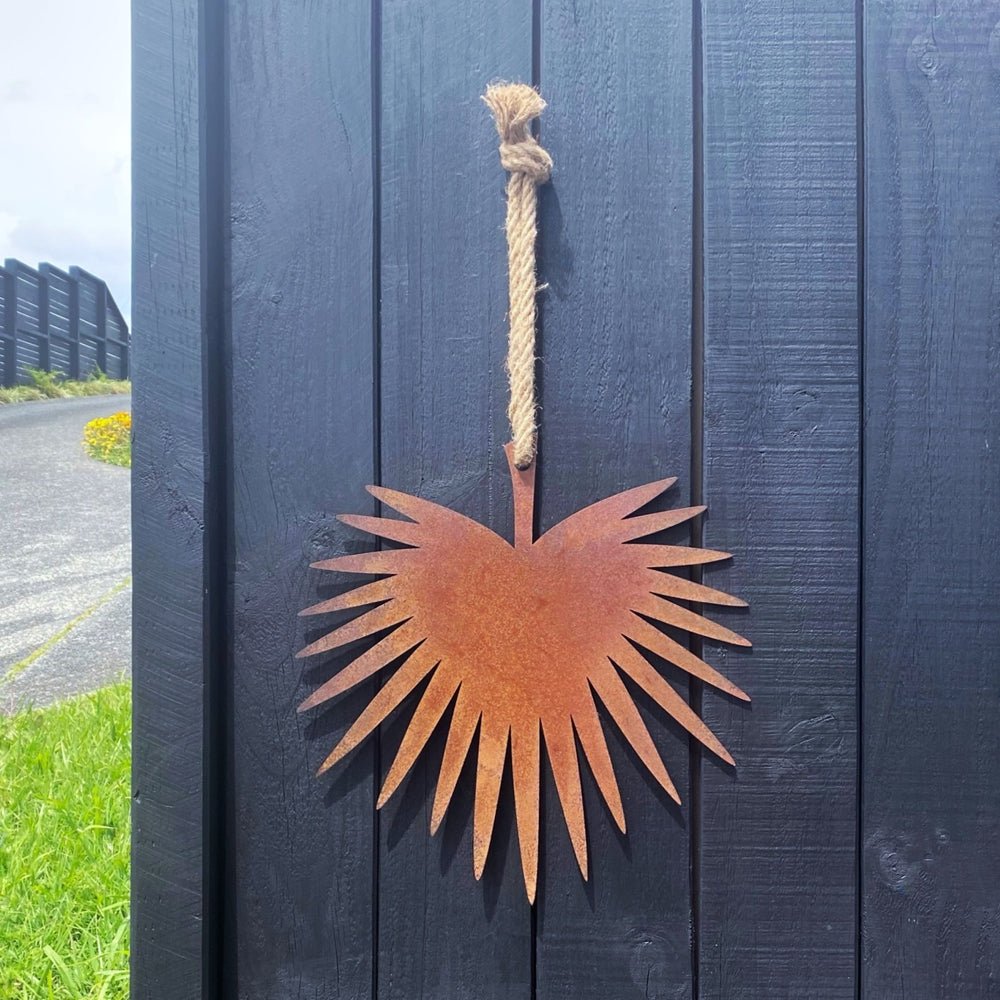 NZ Steel Art.  Corten Fan Palm Wall art on fence. 