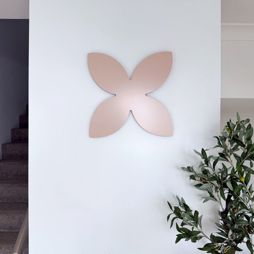 Blush pink frangipani wall art displayed in a stylish entryway