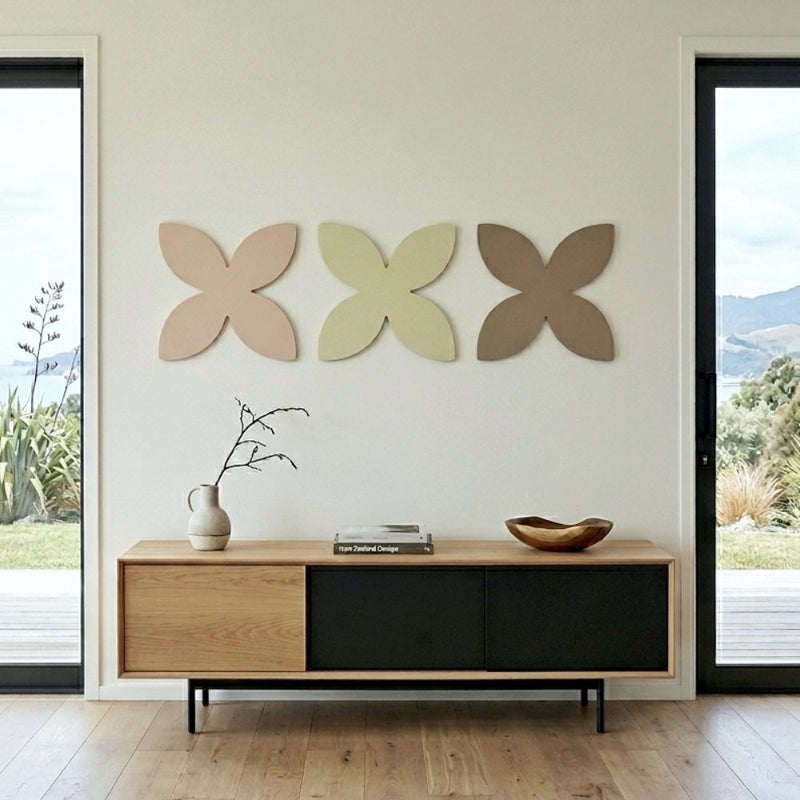Frangipani wall art in modern South Island NZ home, steel wall decor for living room, minimalist coastal style