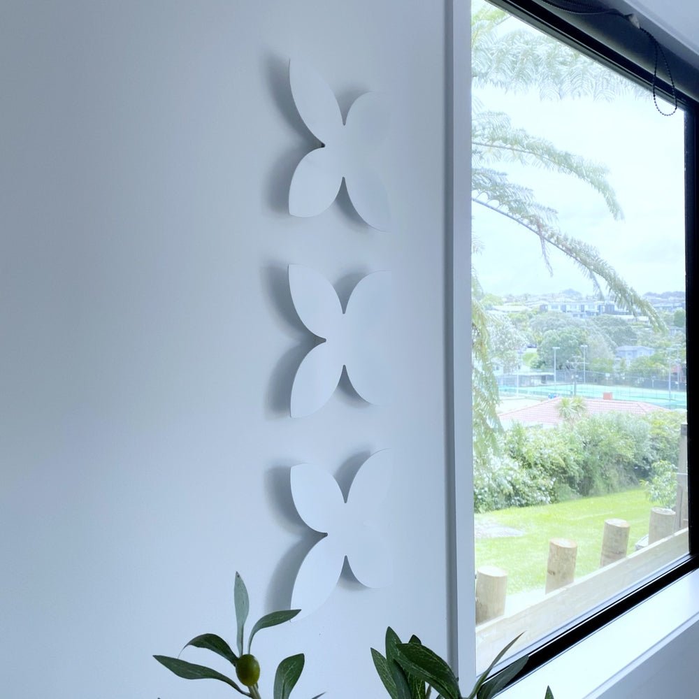 White Steel frangipani wall decor by LisaSarah Steel Designs. 
