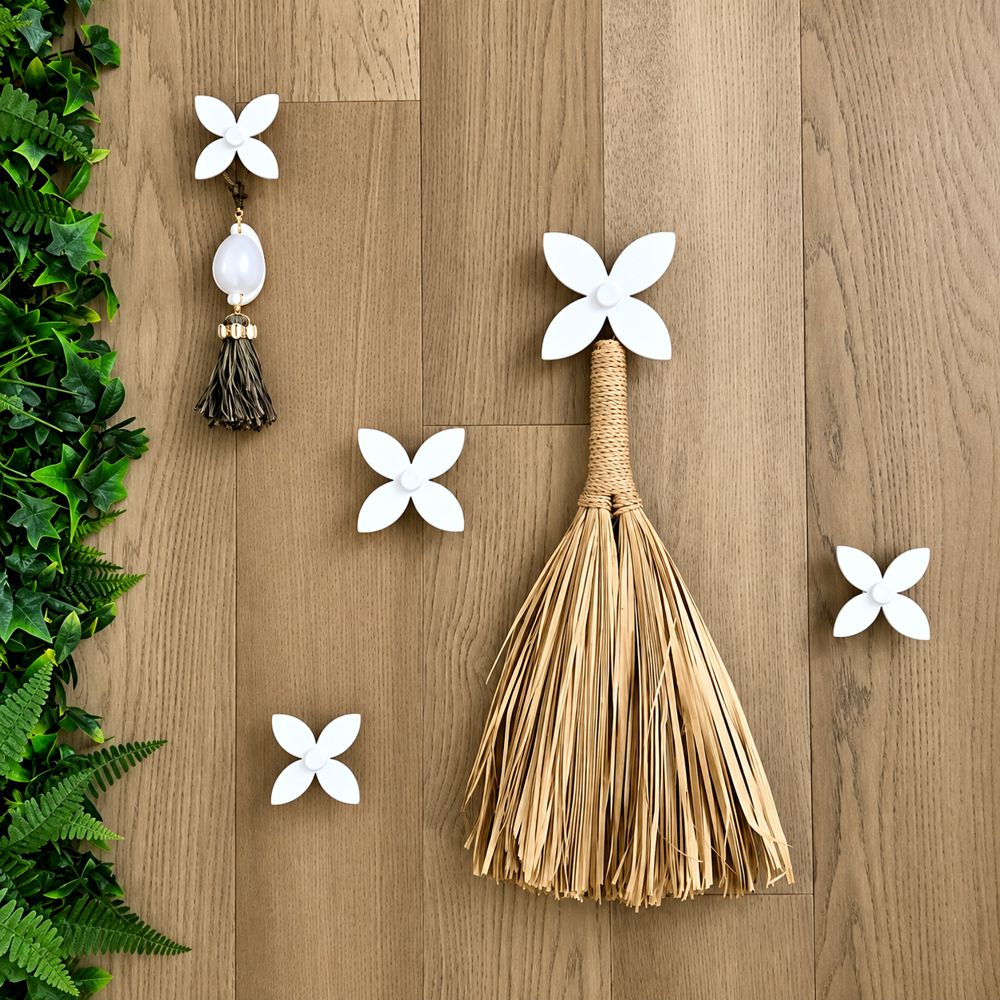 Franigpani set of 5 white decorative wall hooks on timber wall
