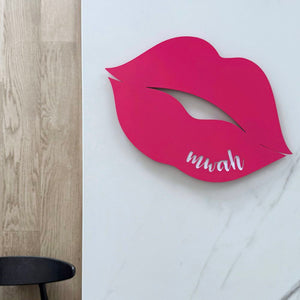 Hot pink steel wall art NZ – “mwah” cut-out design for indoor and outdoor spaces