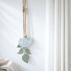 Decorative hanging hydrangea wall hanging in corner of traditional New Zealand living room. 