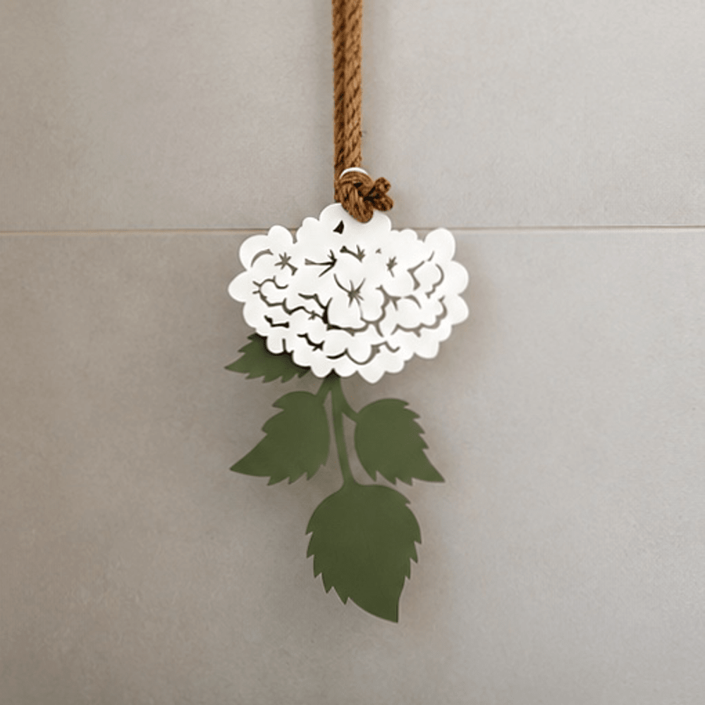 White powder-coated steel hydrangea wall art styled above a bathroom vanity