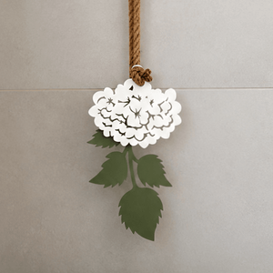 Close-up of white hydrangea steel wall art showing petal detail and powder-coated finish