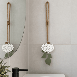 White powder-coated steel hydrangea wall art styled above a bathroom vanity in Auckland 