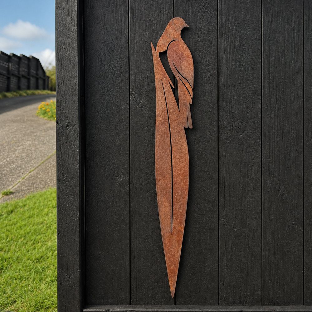 Rusted corten steel kereru on flax garden stake, 90cm tall, planted in a New Zealand garden border
