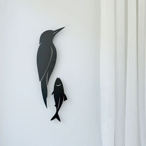 Kingfisher and fish metal wall art in matte black styled in a modern New Zealand living room