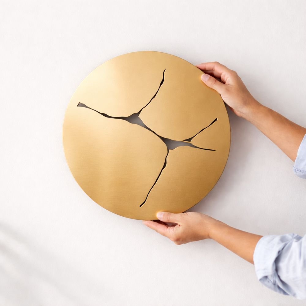 Kintsugi, Japanese inspired minimal round gold wall art in a modern NZ home. 