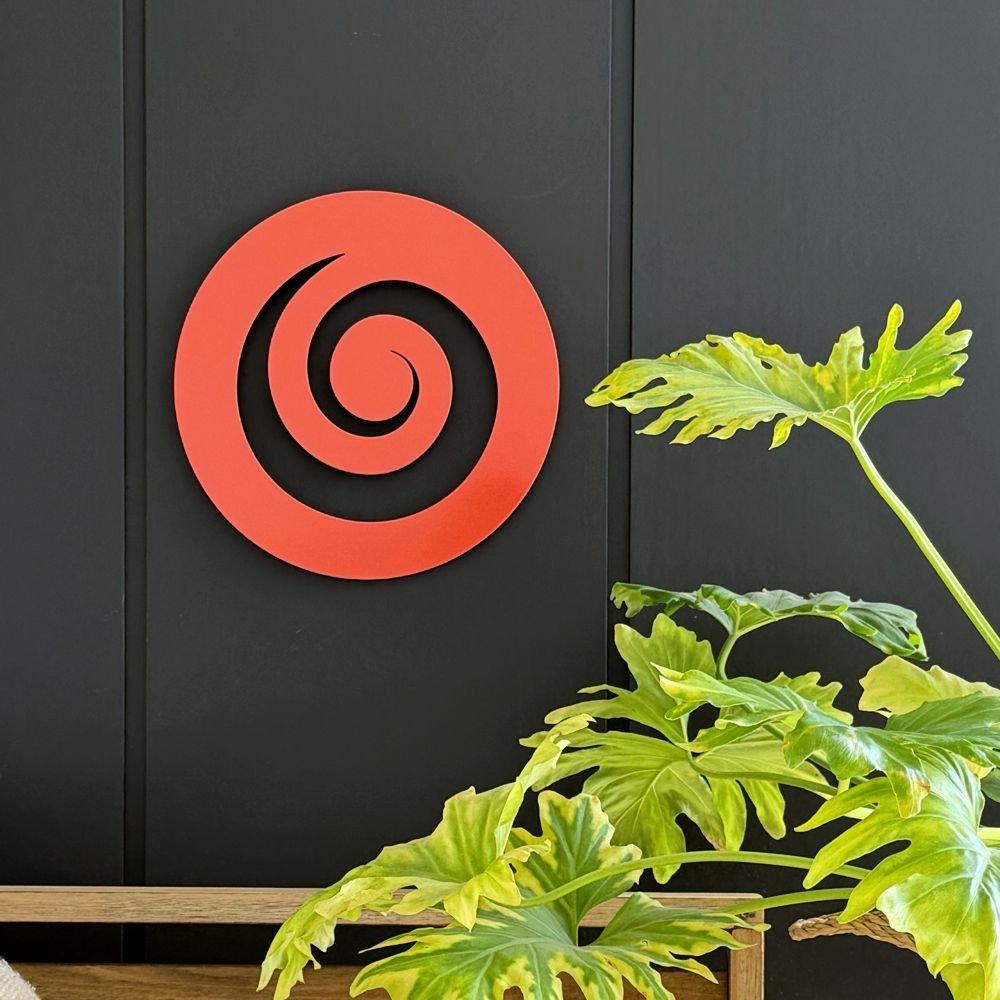 Stylish outdoor orange koru wall art by LisaSarah, enhancing the ambiance of a contemporary New Zealand outdoor space - perfect for Outdoor Wall Art NZ