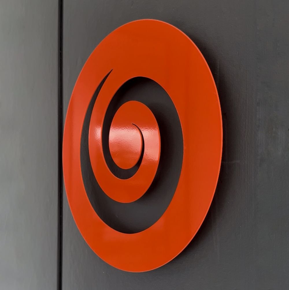 Stylish outdoor orange koru wall art by LisaSarah, enhancing the ambiance of a contemporary New Zealand outdoor space - perfect for Outdoor Wall Art NZ