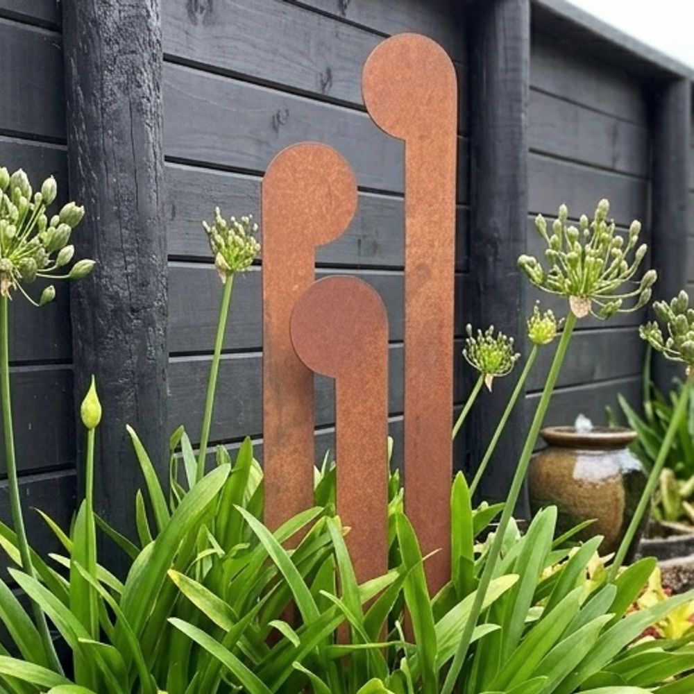 Front view of 3 corten steel koru garden stakes NZ – varying heights – LisaSarah Steel Designs