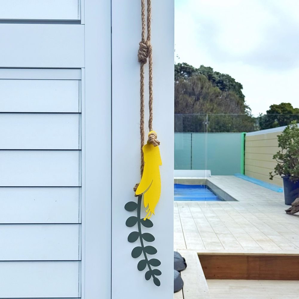Metal Wall Art on fence in New Zealand garden.
