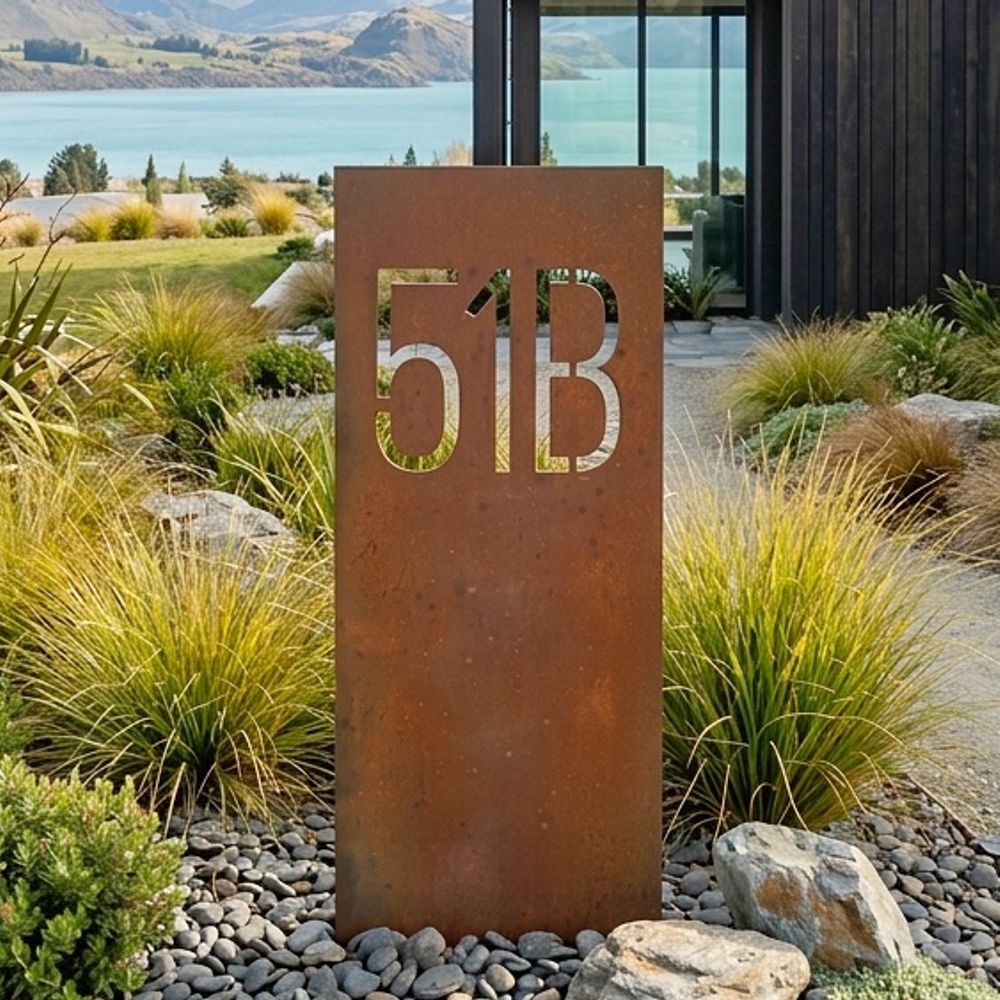 XL corten steel inground house number installed in front of a modern architectural home in Wanaka New Zealand