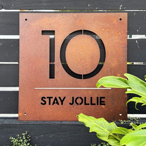 Modern custom Airbnb sign made from corten steel in New Zealand home