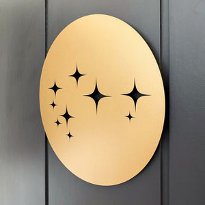 Close-up side profile of matte gold Matariki steel wall art highlighting thickness and powder-coated finish for indoor and outdoor use
