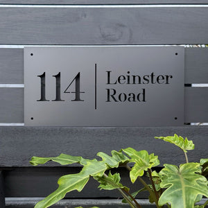 Medium black steel address sign mounted on a black fence in New Zealand – weatherproof, NZ-made outdoor signage by LisaSarah
