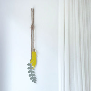 NZ Kowhai yellow decor in corner of lounge in New Zealand. 