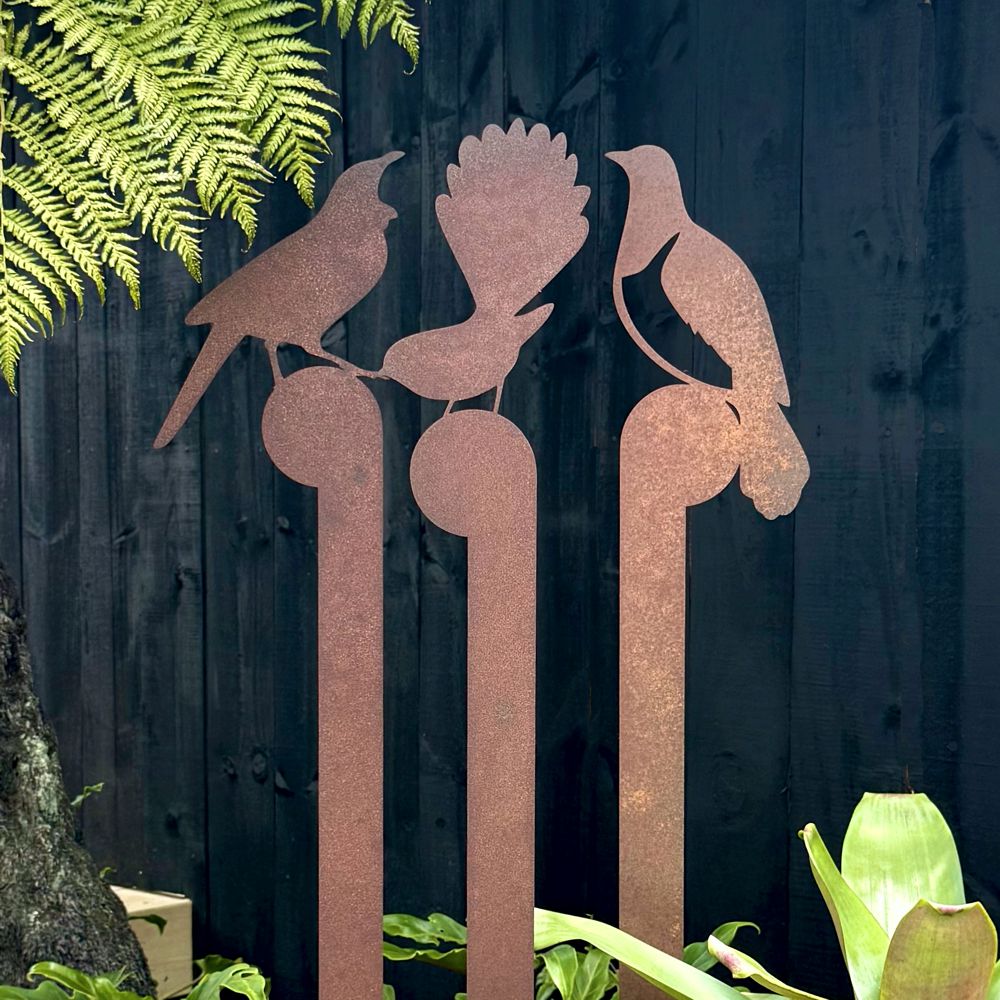 NZ-made corten steel garden art stakes featuring Fantail, Tui, and Kereru birds, perfect for outdoor gardens and patios.

