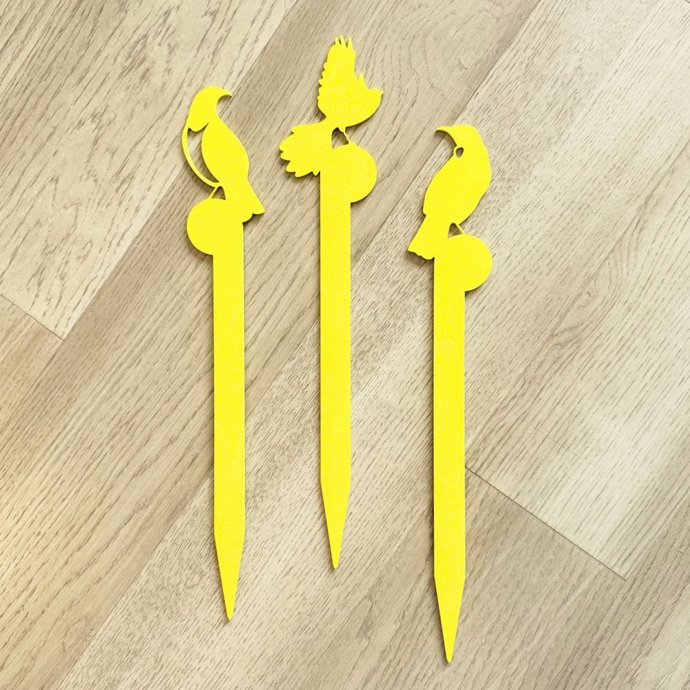 Yelllow aluminium NZ bird garden  planter stakes in garden in New Zealand. 