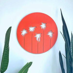 Bright orange palm tree wall art on wall in living room in New Zealand modern home. 