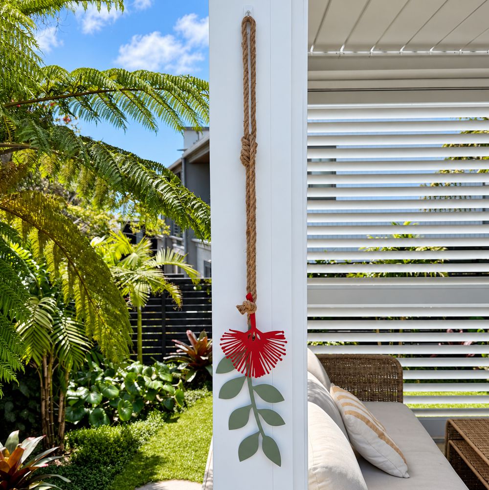 Pohutukawa wall hanging on black house in NZ patio