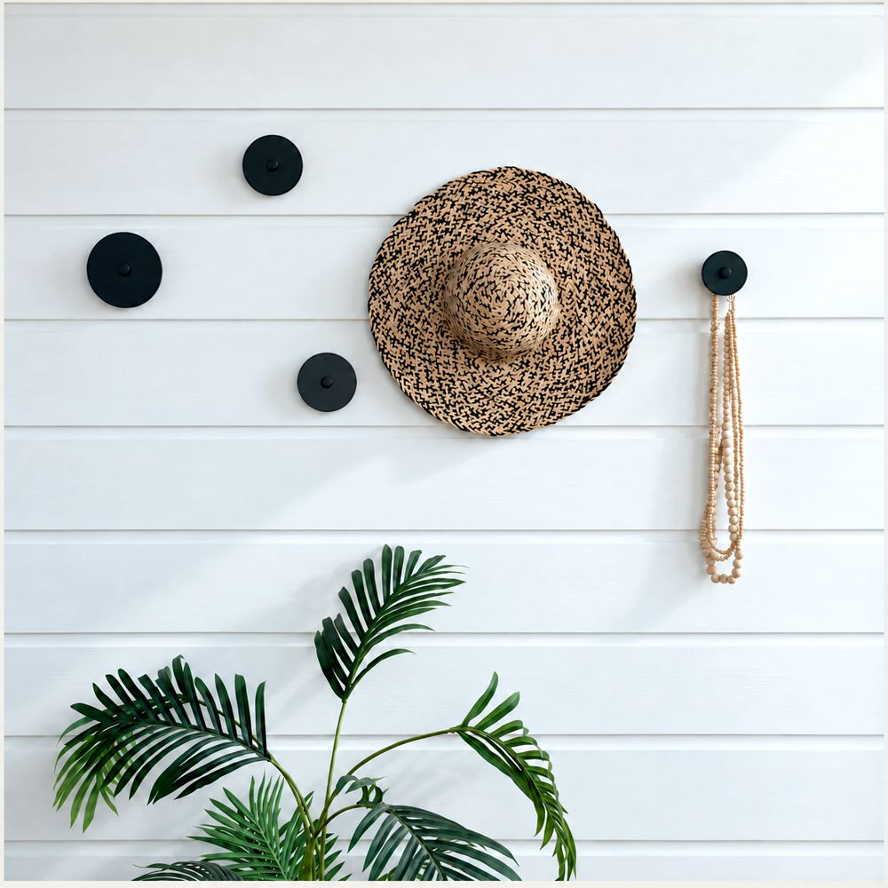 Three round steel wall hooks side by side in 7.5cm, 10cm and 12.5cm sizes