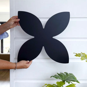 Black steel frangipani wall art displayed in a modern coastal New Zealand home – elegant botanical metal decor by LisaSarah
