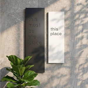 this must be the place and this place modern wall art in entryway of new Zealand office. 